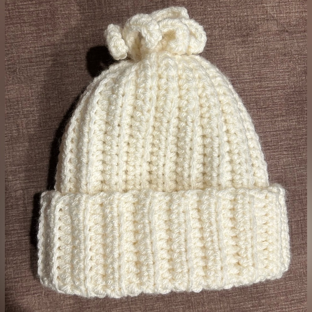 Hand crocheted fun fringe beanie, fits size 6-9 months. 100% acrylic yarn, NEW